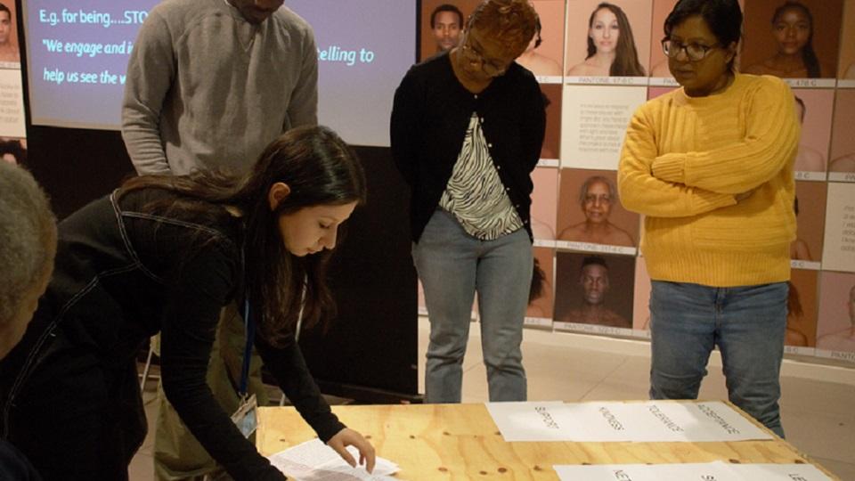 Mona Jamil working with others on a project