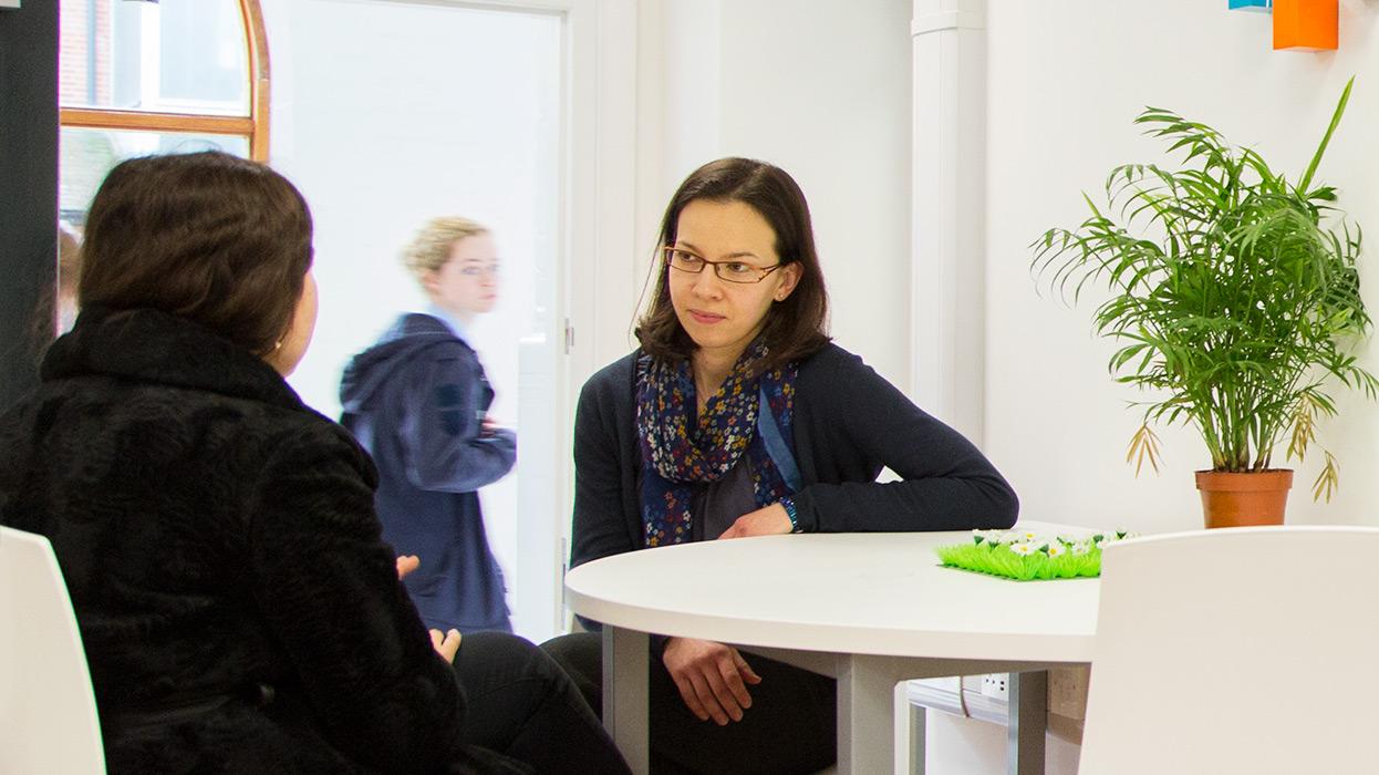 Advisor speaking to a student