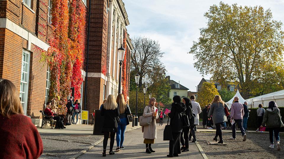 Students and staff outside the Richard Hoggart Building at an open day