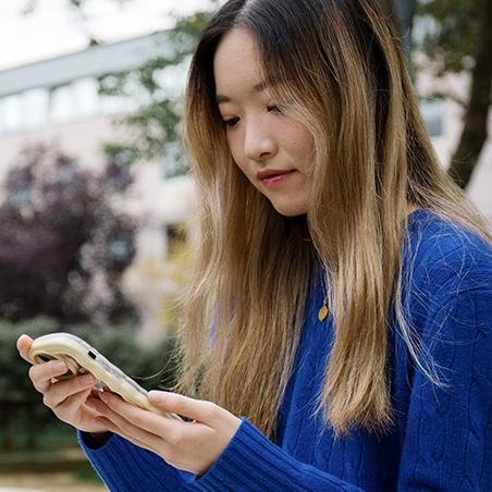 Student looking at a phone