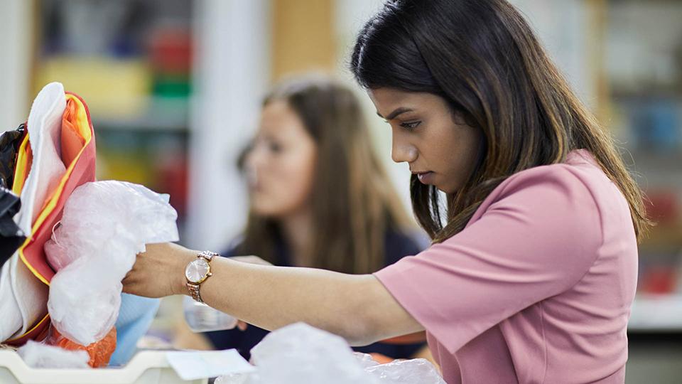 A female PGCE student working in a seminar